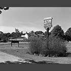black and white photo of village sign on the green in Barrington