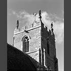 black and white photo of the tower of St Margarets Church Abbotsley